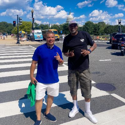 Photo of Gerald Johnson and Red Grant while crossing the road. 